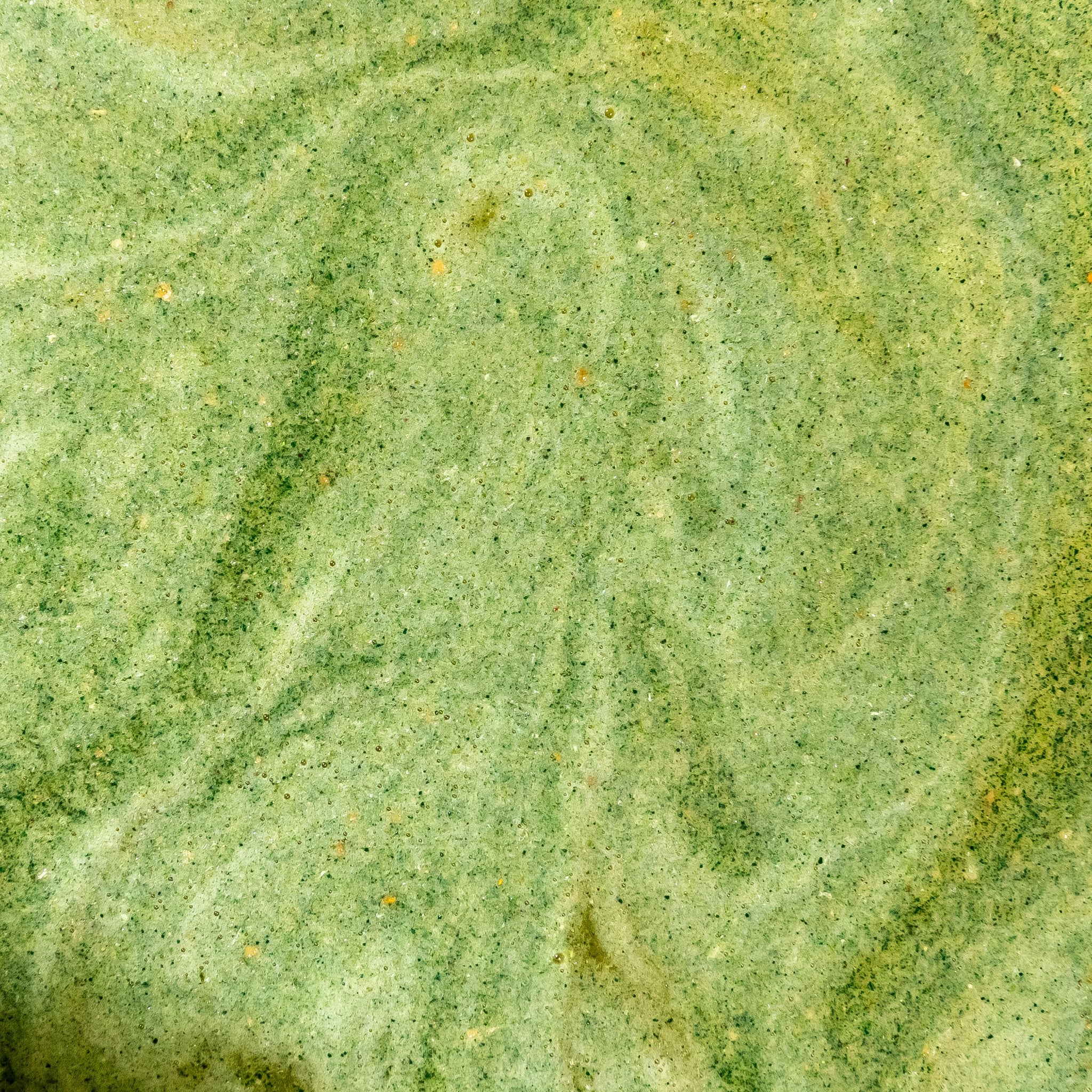 Swirling green texture of a freshly mixed Releaf drink