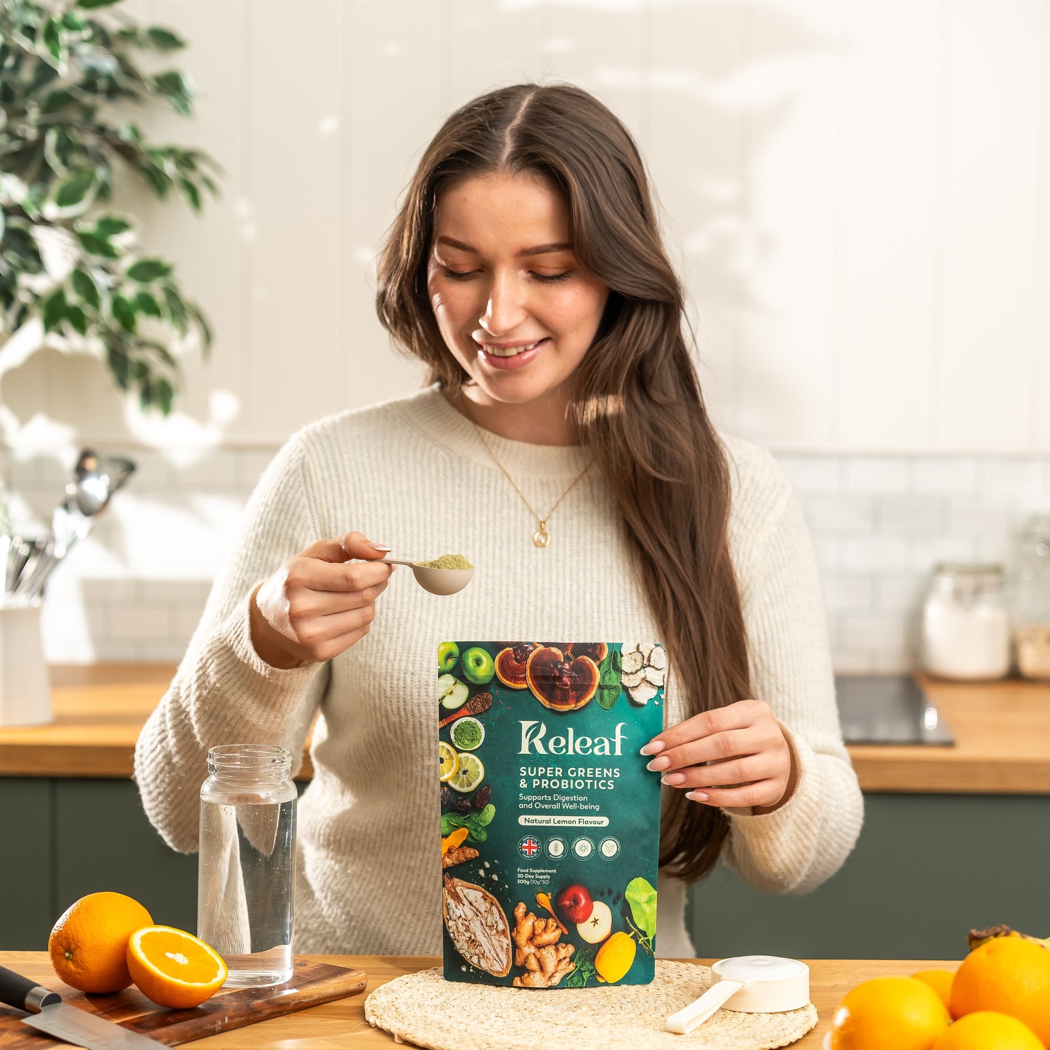Woman preparing her daily Releaf Super Greens drink in a bright kitchen