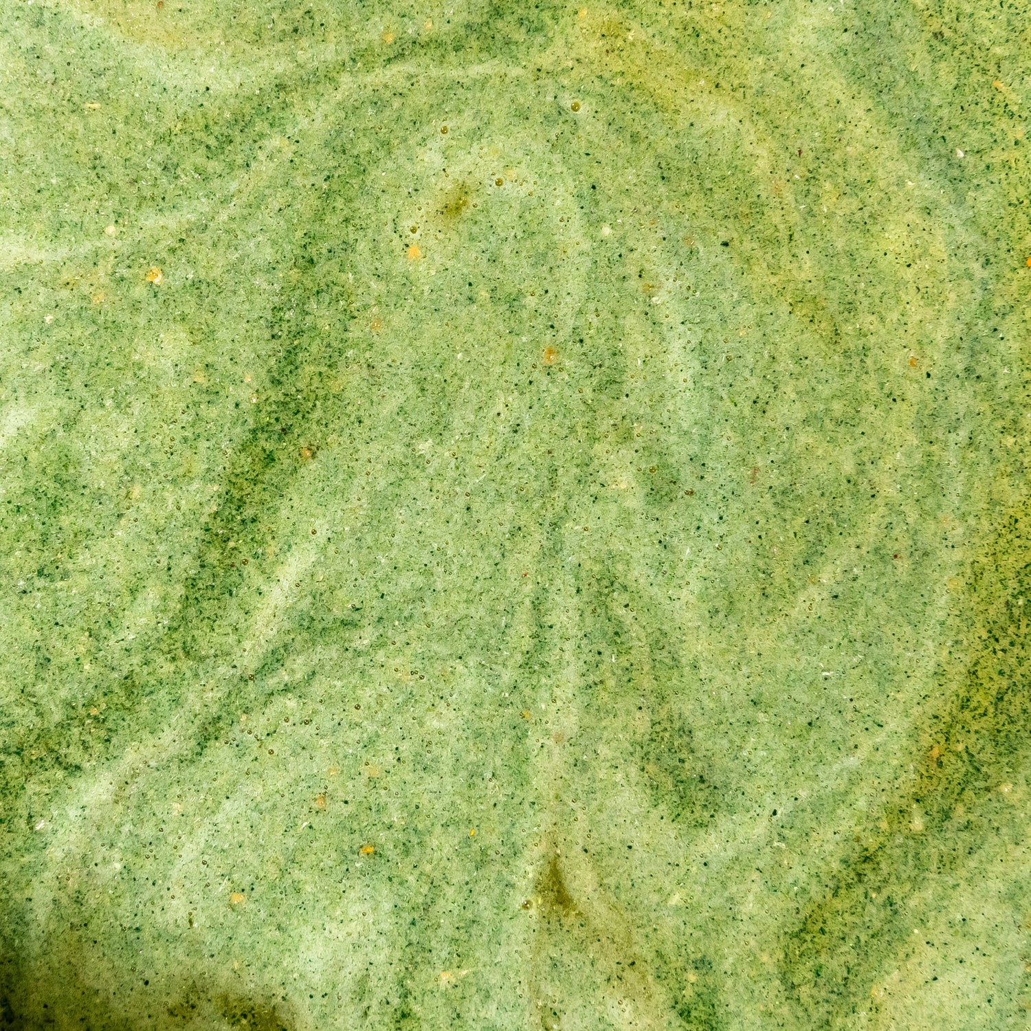 Swirling green texture of a freshly mixed Releaf drink