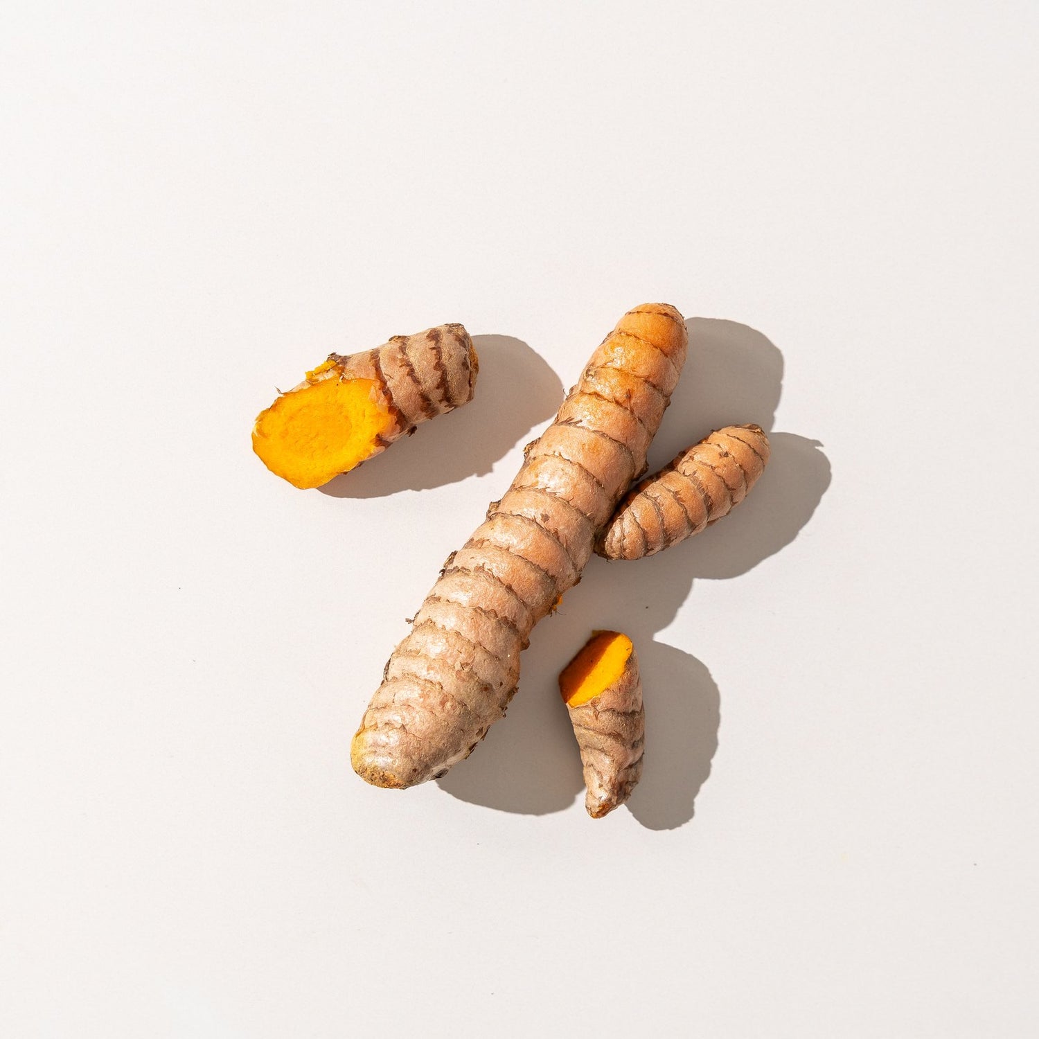 Fresh turmeric root with vivid orange flesh