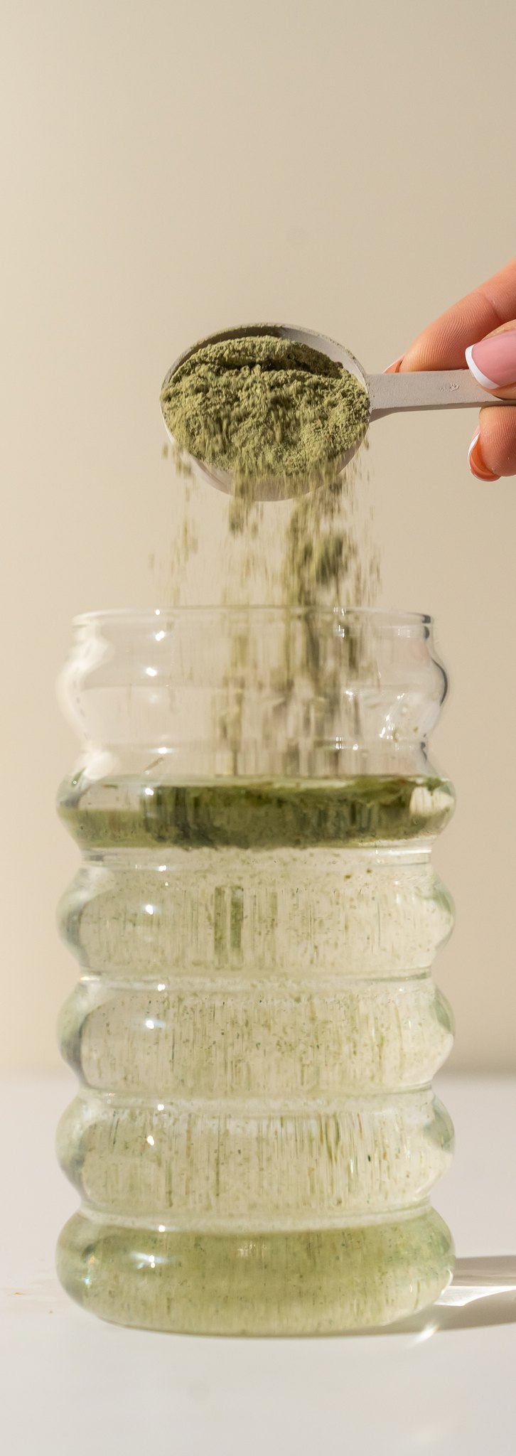 Step 2 - add one 10g scoop of Releaf Super Greens