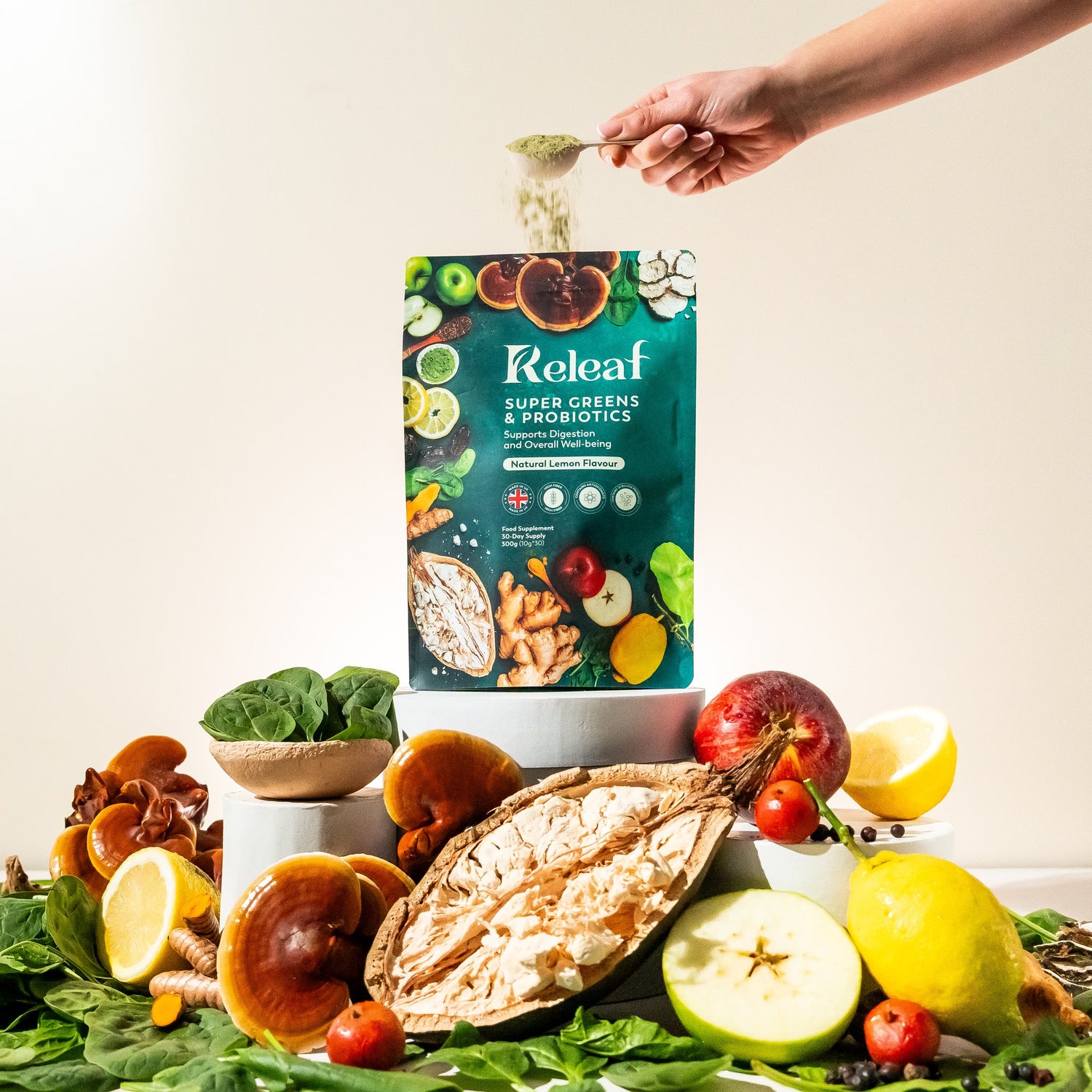 Green superfood powder sprinkled over the Releaf pouch with fresh ingredients below